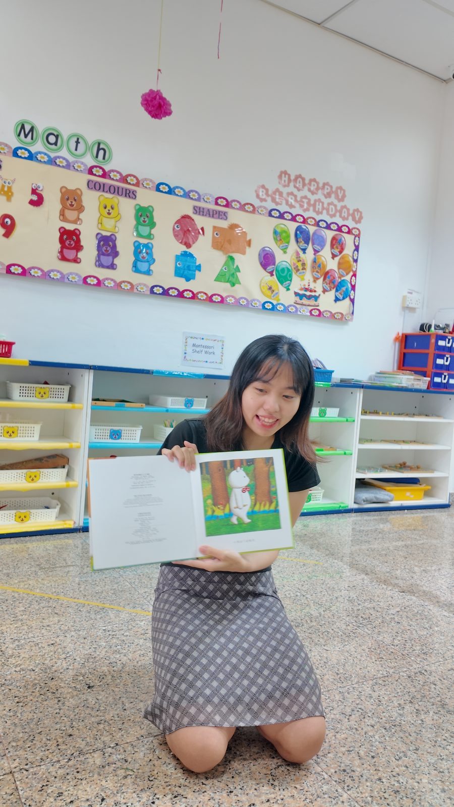 Teacher showing picture book