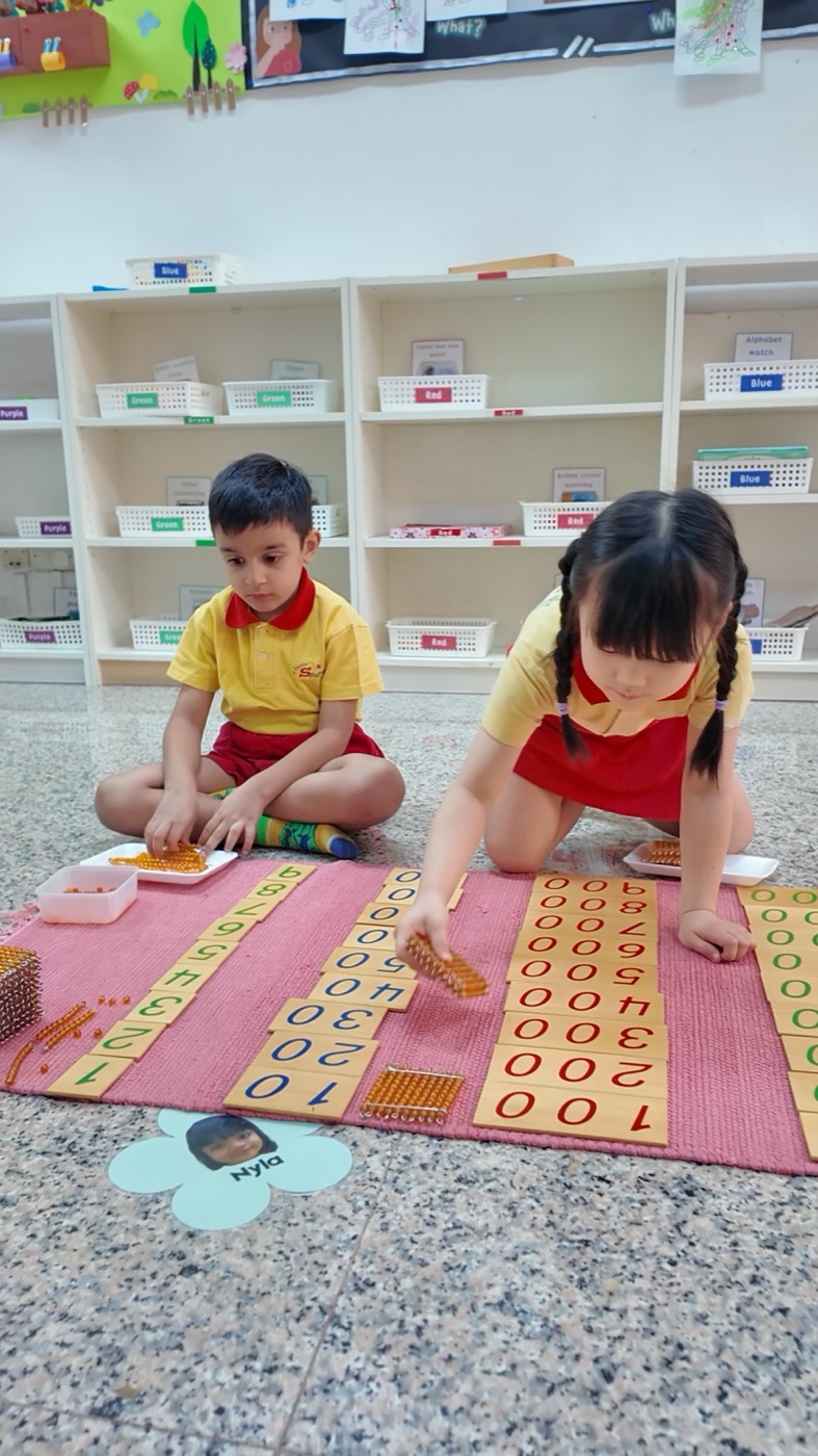 Child working with Montessori materials