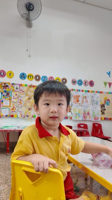 A child feeling secure and valued in the classroom